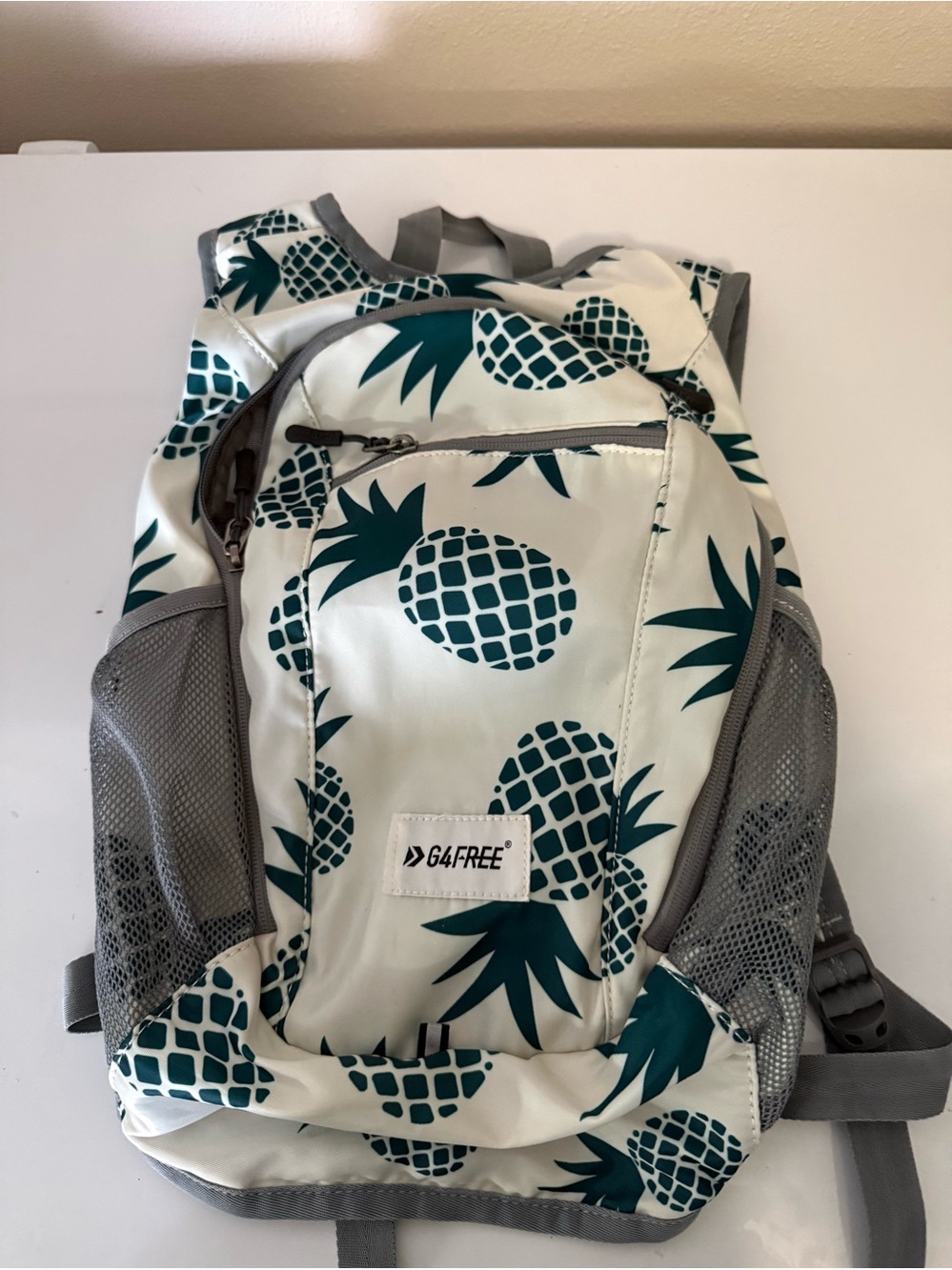G4Free White Backpack with Teal Pineapple Print